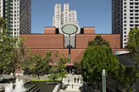 View of SFMOMA Botta building with trees and surrounding buildings