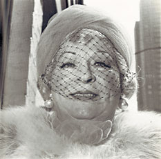 older woman in veil and fur collar