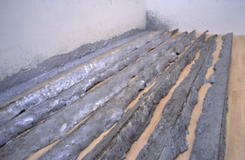 eight metal strips on wood floor