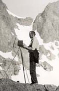Ansel Adams with camer on mountain