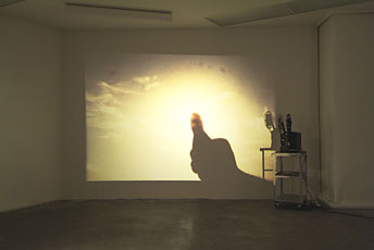 installation shot projected image of sky onto wall