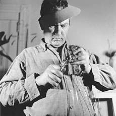 Calder, man holding tool working in studio
