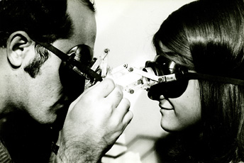 man and woman looking at each other wearing goggles