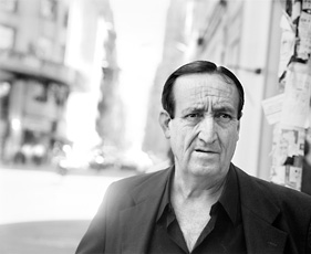 Rubinfien, portrait of older man with dark hair on city street