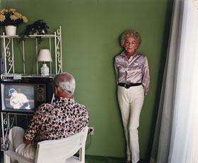 Larry Sultan, photograph of mother standing up and father watching tv