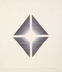 four dark geometric shapes forming diamond on paper