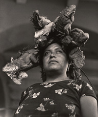 photograph of woman in Mexico with four iguanas on head