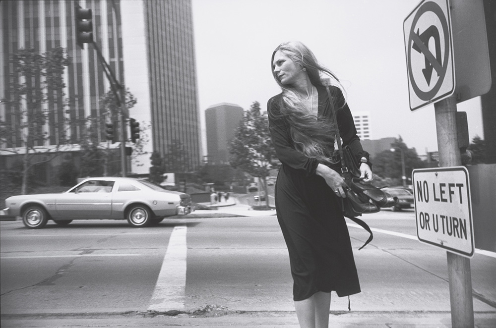 Garry Winograd, photograph of woman walking across street