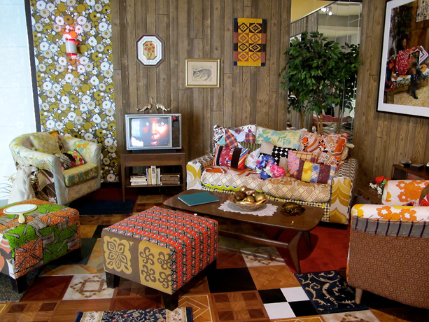 Mickalene Thomas, colorful living room with couches chairs and tv