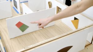 A maquette of a museum gallery with miniature works by Ellsworth Kelly