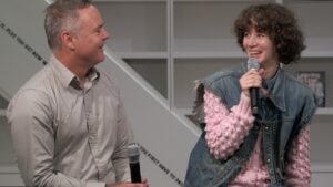 Artists Harrell Fletcher and Miranda July laughing to each other during a panel discussion