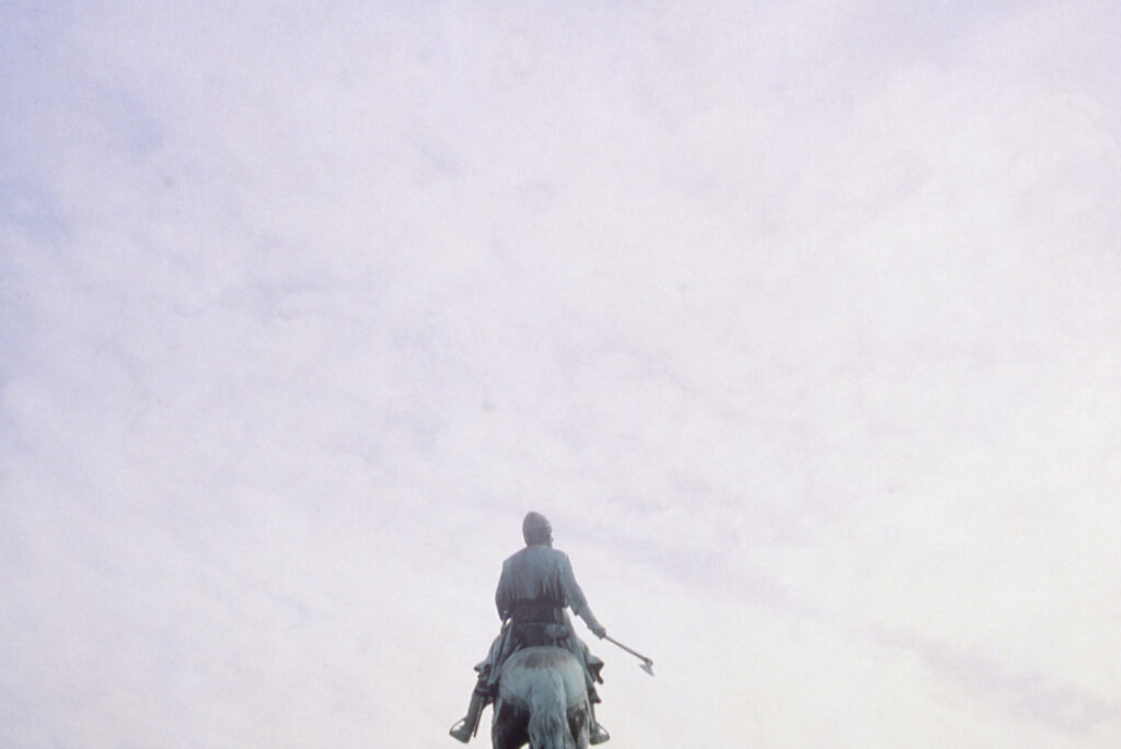Image of the sky above a statue of a man on a horse