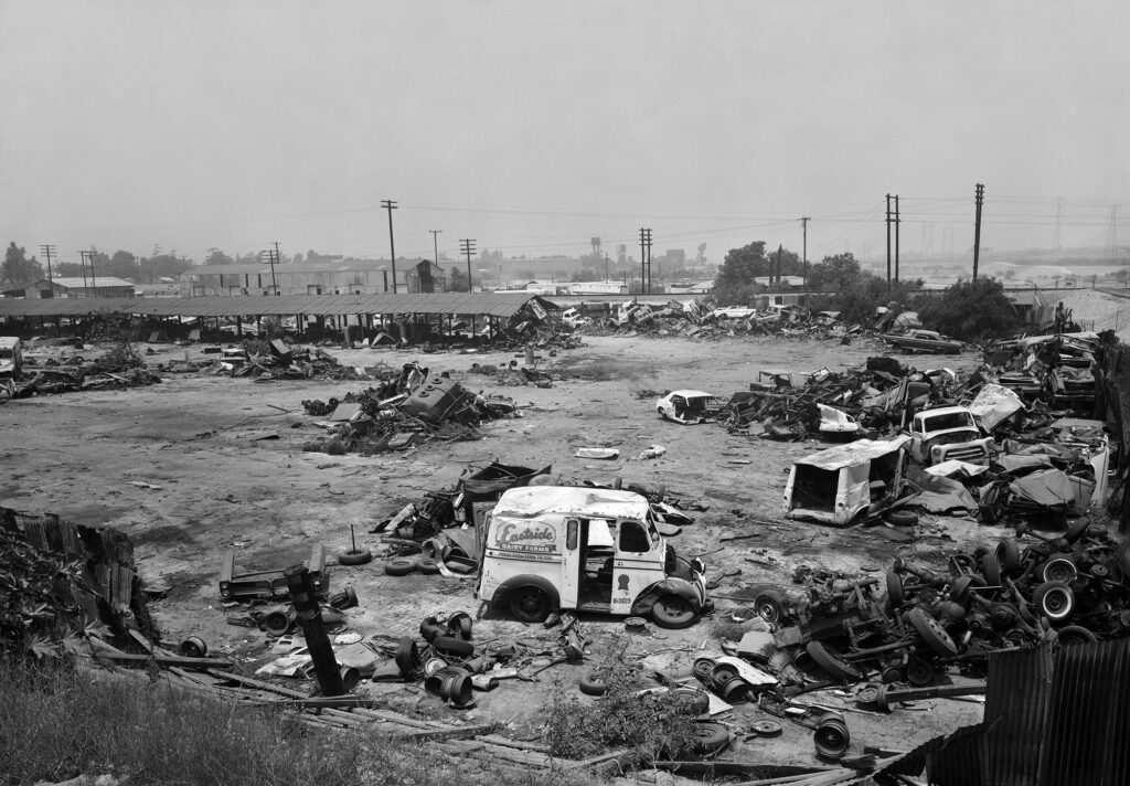 Black and white image of a metal scrap yard