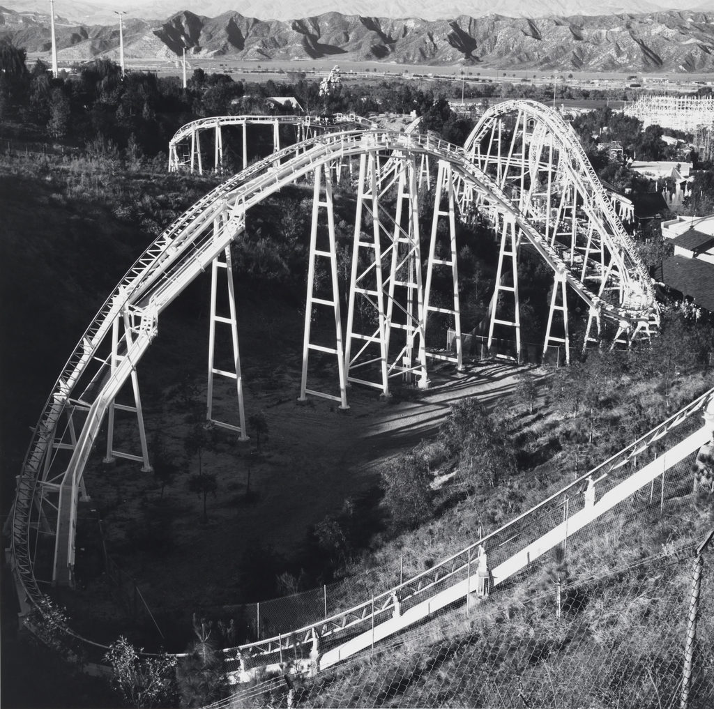 A black and white aerial photograph of a roller coaster