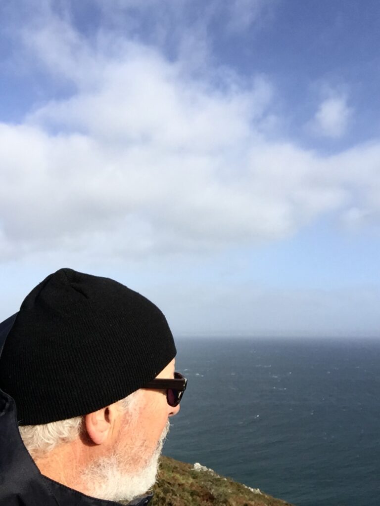 Photograph of Kent Roberts looking out at the ocean