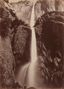 Sepia toned black and white photograph of a waterfall