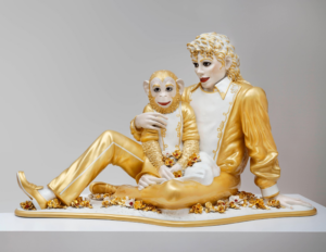 A lifesize gilded white porcelain sculpture of Michael Jackson and the chimpanzee Bubbles