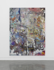 An abstract painting hangs on a white wall over a grey floor