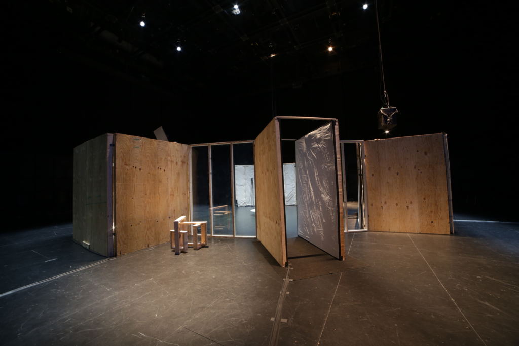 A dark room with rectangular wooden structures installed, Gordon Soundtracks
