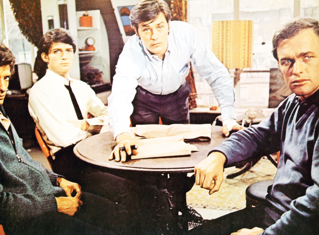 Four men sitting around a table