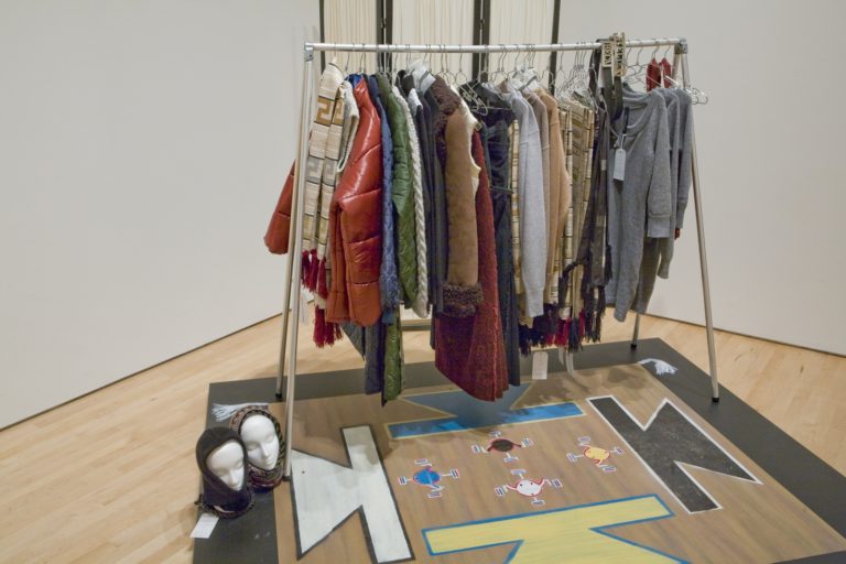 A clothes rack filled with fashionable clothes