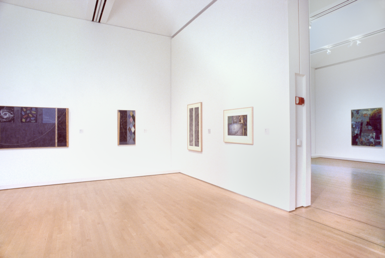 A room with several works by Jasper Johns