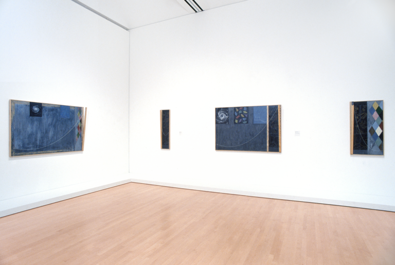 A room with several works by Jasper Johns