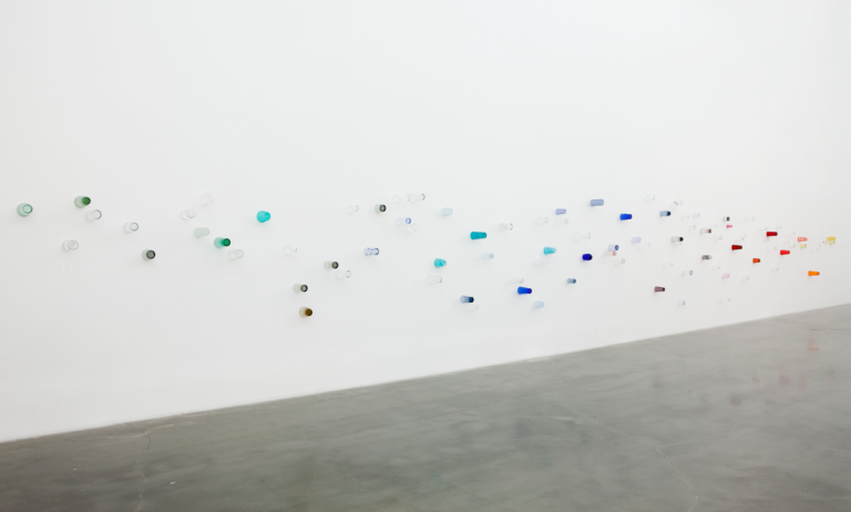 White wall with glass cups attached, Pica Soundtracks