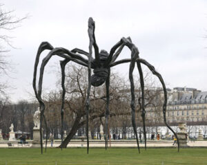 A large cast bronze spider in a park