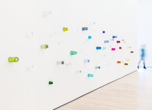 Colored drinking glasses mounted on a white wall, Pica, Soundtracks