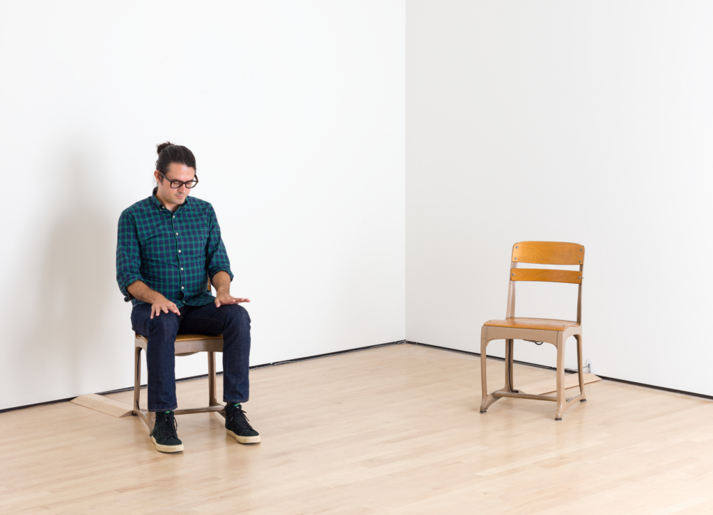 A Caucasian man with dark hair and glasses sits on one of two school chairs, Tcherepnin, Soundtracks