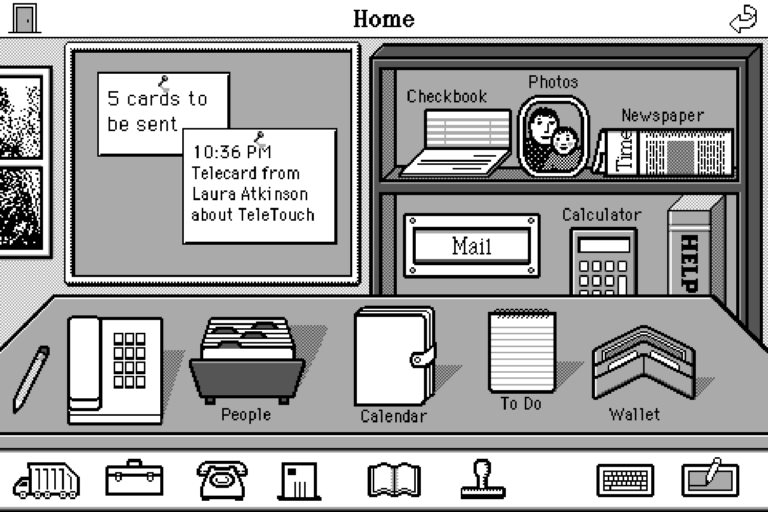 A grayscale 8-bit illustration of a desk with icons and all items labeled