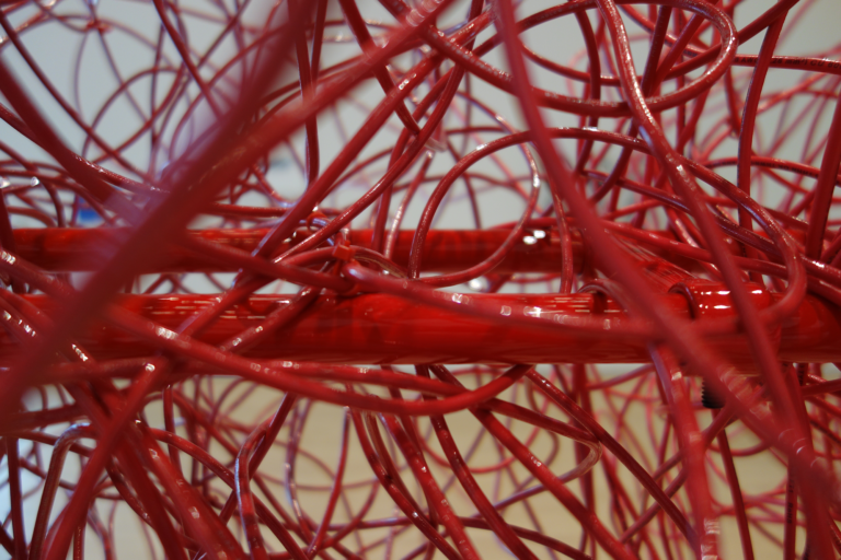 Color photograph of a red tangle of chords, Kubisch, Soundtracks