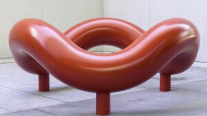A wavy red circular sculpture
