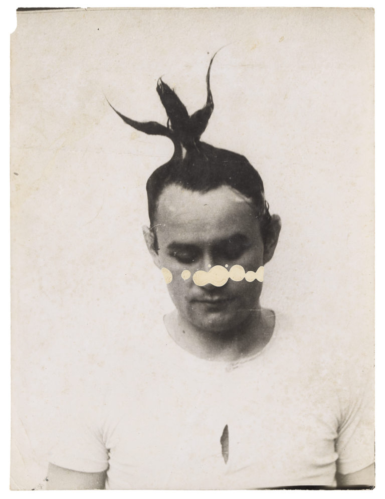 Johanne Brus, photo of young man with spiked hair and paint drips on his face 