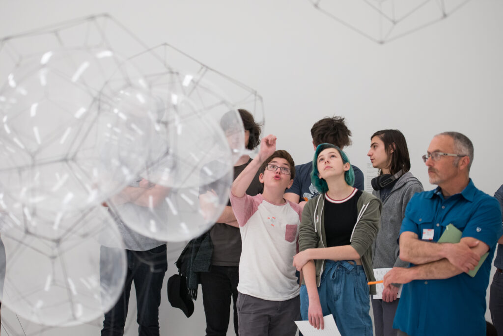 People observing a bubble-like structure