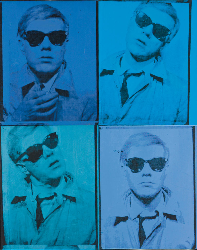 blue tone self portrait of andy warhol in sunglasses and trench coat