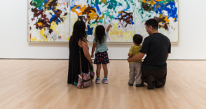 A family looking at a Joan Mitchell painting