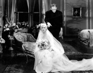 Black and white film still of Frankenstein and a bride