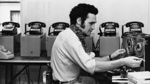 John Giorno, poet and organizer of the Dial-A-Poem project, sets up a reel of recorded poetry at the Architectural League in Manhattan.