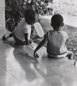 Birthday Party, Haiti [Two Children Sitting on Tiled Steps]