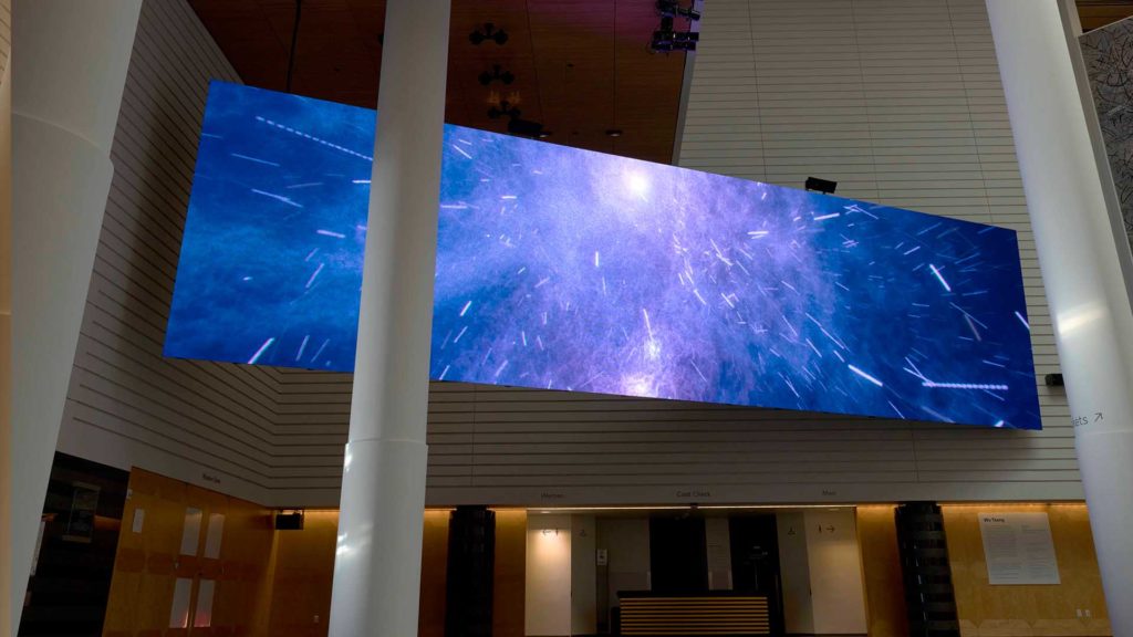The video and sound installation Of Whales by Wu Tsang envelops visitors in an oceanscape-cosmos as it hangs over the SFMOMA atrium.